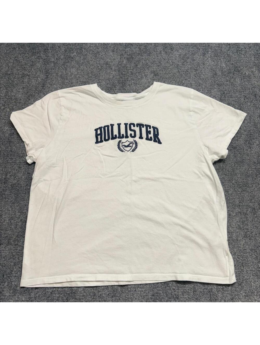 Hollister Co. white cotton t-shirt with navy blue text and laurel wreath logo